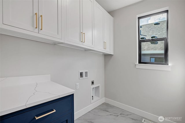 21407 39th Dr SE Unit A, Bothell, WA 98021 - laundry area with cabinet space, washer hookup, baseboards, electric dryer hookup, and light marble finish floors