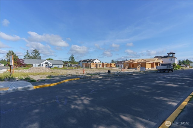 117 7th St SW, Long Beach, WA 98631 - view of asphalt road featuring curbs, a residential view, and sidewalks