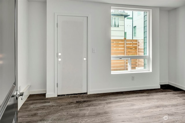 unfurnished bedroom featuring dark hardwood / wood-style floors