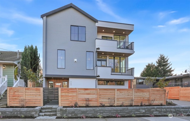 back of house with a balcony