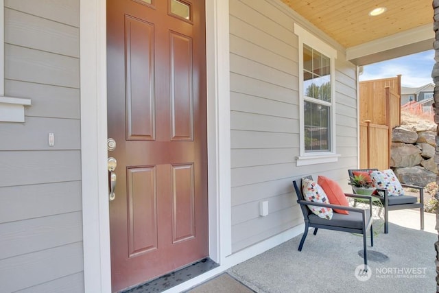 property entrance with covered porch