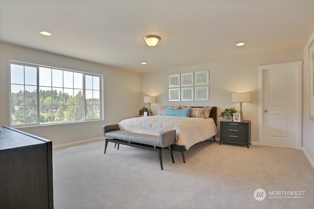 bedroom featuring light carpet