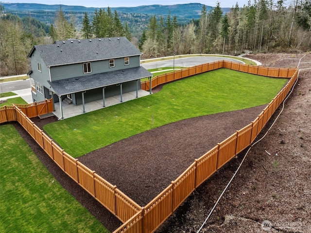 exterior space featuring a mountain view and a forest view