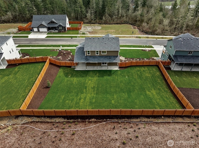 birds eye view of property with a forest view