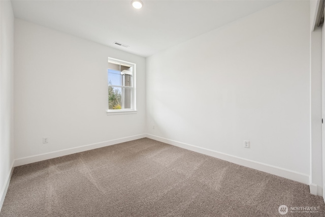 unfurnished room with carpet flooring, recessed lighting, baseboards, and visible vents