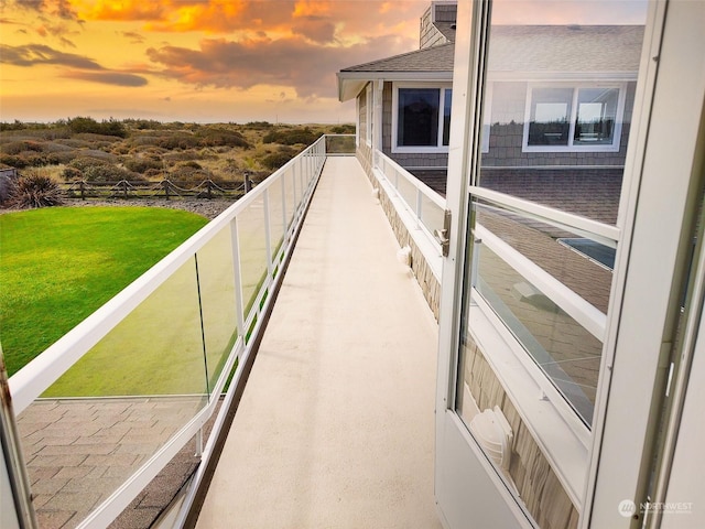 view of balcony at dusk