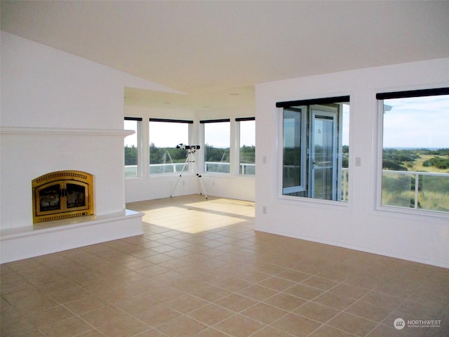 unfurnished living room featuring light tile patterned floors