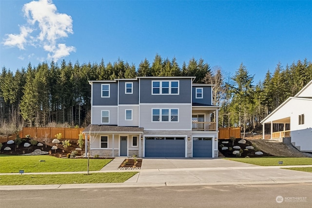 view of front of house with a garage and a front lawn