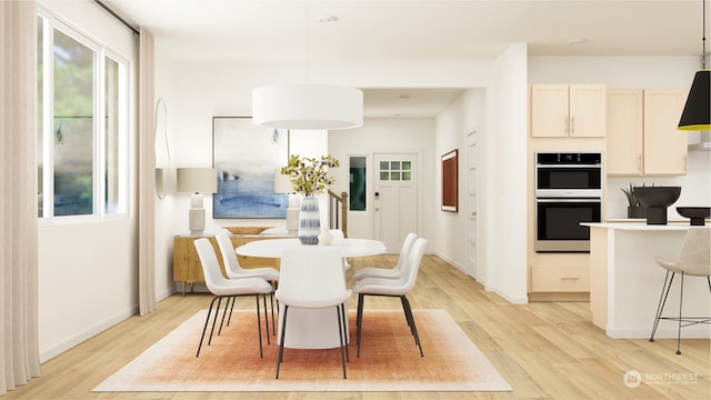 dining room with light wood-type flooring