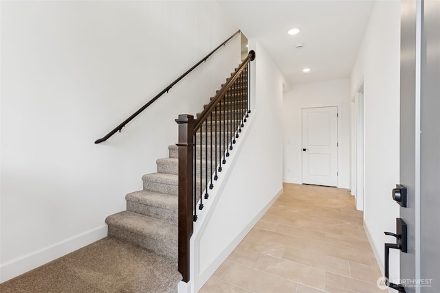 staircase featuring recessed lighting and baseboards