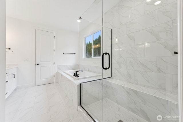 full bathroom with vanity, baseboards, a stall shower, a bath, and marble finish floor