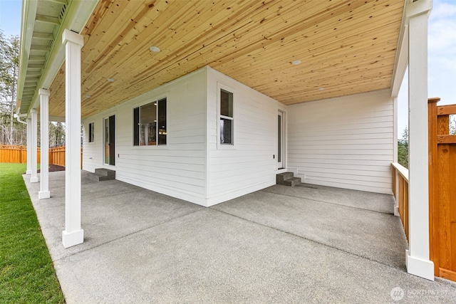 view of patio / terrace with entry steps and fence