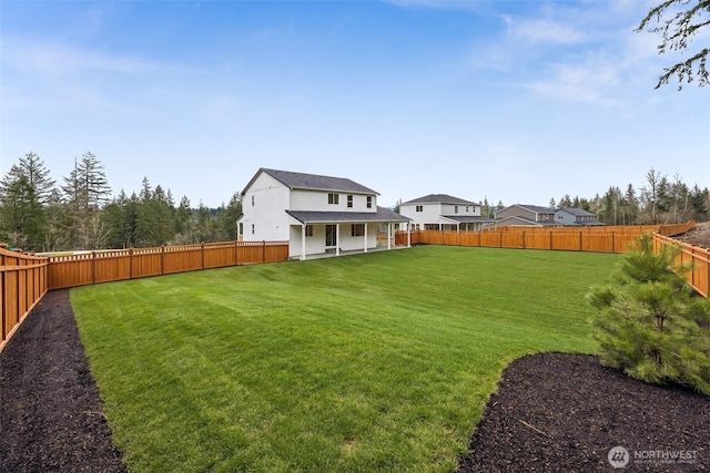 view of yard featuring a fenced backyard