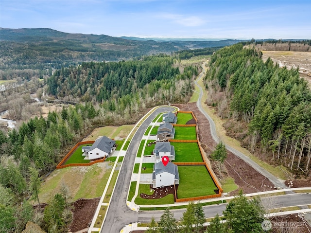 bird's eye view featuring a mountain view and a forest view