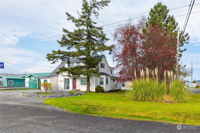 view of front of home with a front lawn