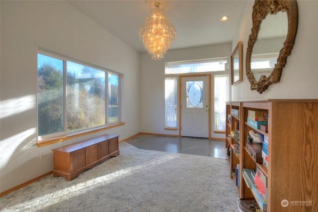 foyer entrance featuring a chandelier