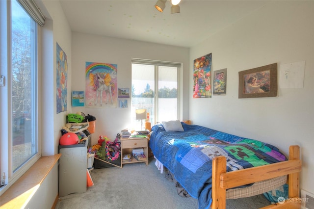 carpeted bedroom with ceiling fan