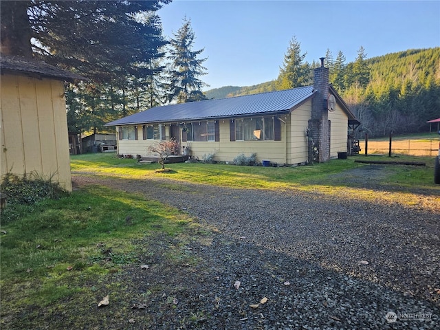 ranch-style home with a front yard