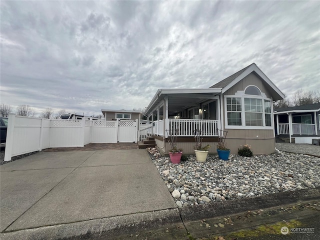 view of side of property featuring a porch