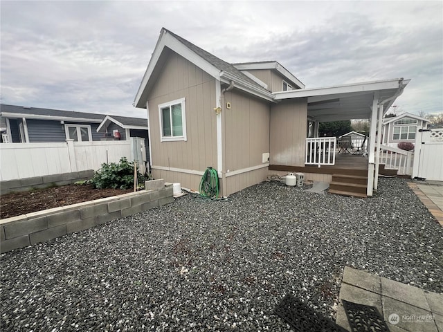 view of side of property with a deck