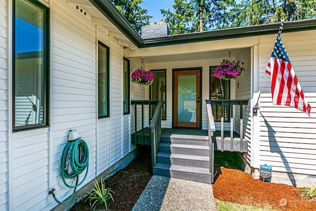 entrance to property featuring a porch