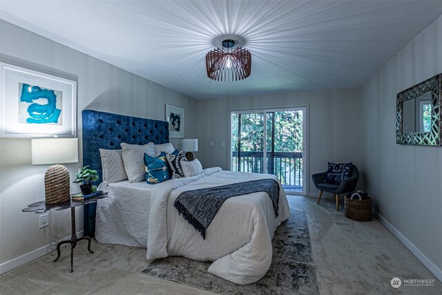 bedroom featuring access to outside and carpet floors