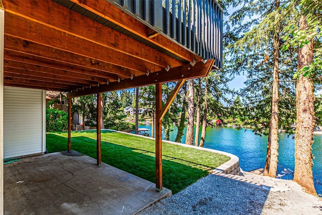 view of patio with a water view