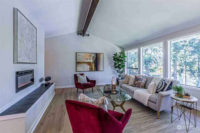 living room with lofted ceiling with beams and hardwood / wood-style flooring