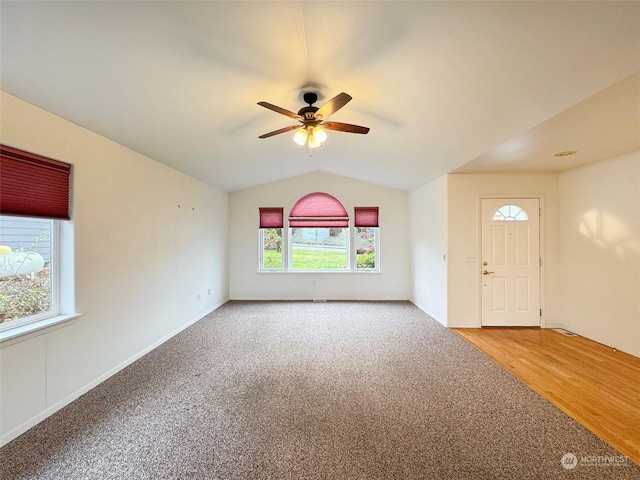 interior space featuring ceiling fan, hardwood / wood-style floors, and lofted ceiling