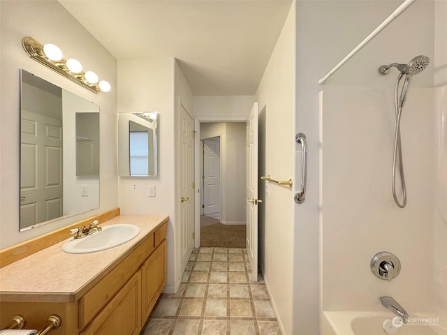 bathroom featuring shower / washtub combination and vanity