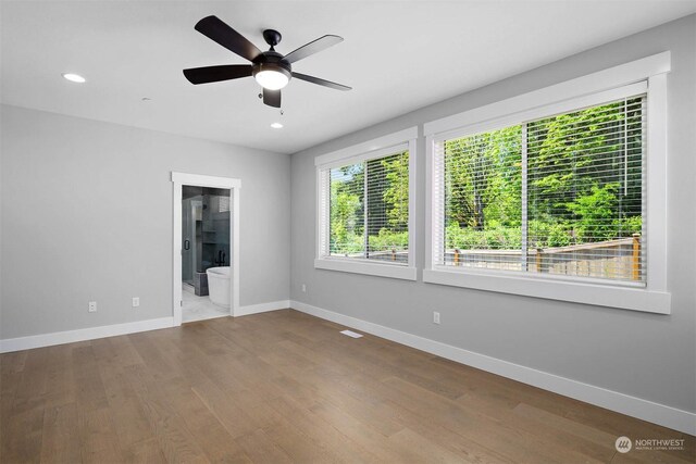 unfurnished room featuring light wood-type flooring and ceiling fan