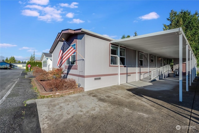 view of home's exterior featuring a carport