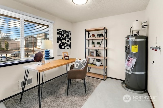 home office featuring secured water heater and a textured ceiling