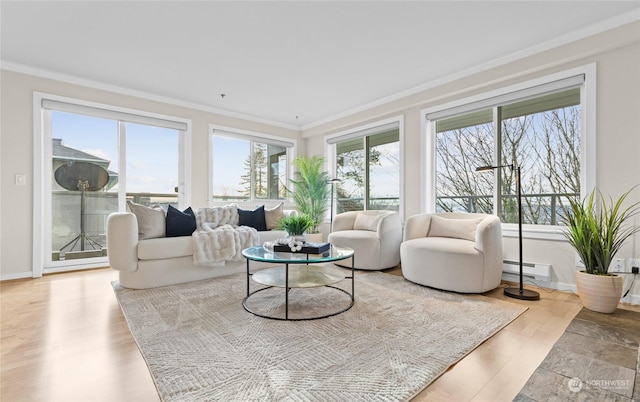 sunroom / solarium with plenty of natural light and a baseboard radiator