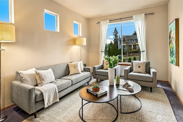 living area with carpet and baseboards