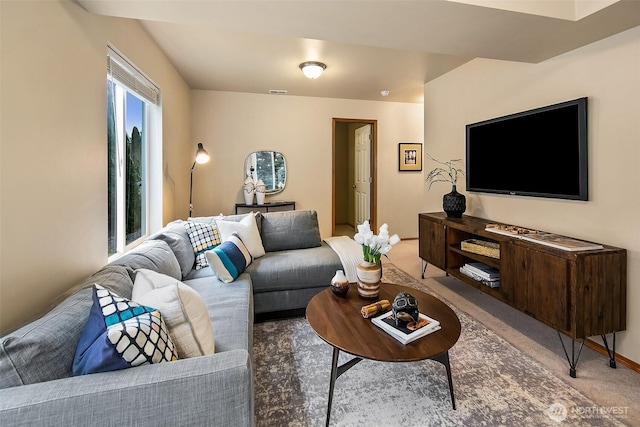 living room with carpet floors and visible vents