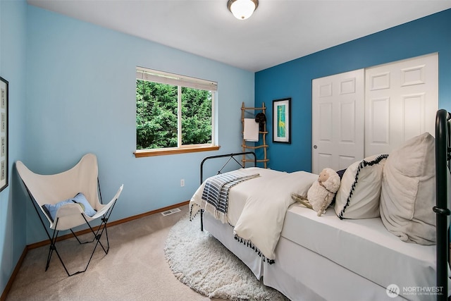 bedroom featuring baseboards, visible vents, and carpet flooring