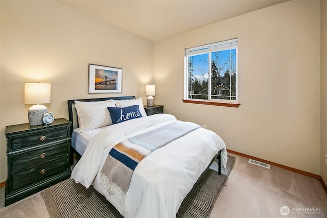 bedroom with carpet, baseboards, and visible vents