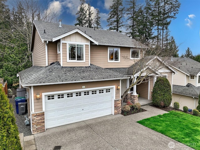 view of front of property with driveway, a shingled roof, stone siding, an attached garage, and board and batten siding