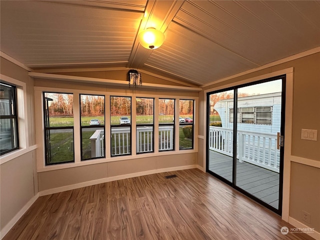 unfurnished sunroom with wooden ceiling and lofted ceiling