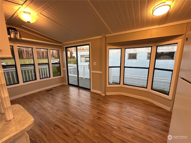 unfurnished sunroom with wooden ceiling and vaulted ceiling