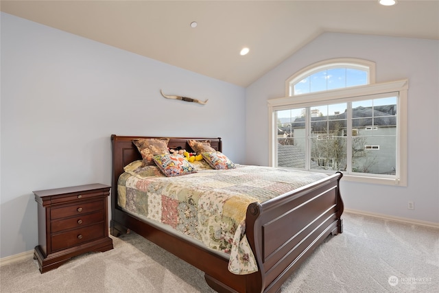 carpeted bedroom featuring vaulted ceiling