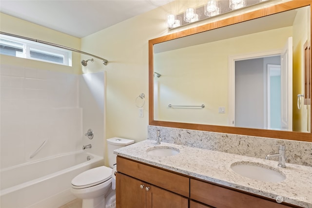 full bathroom featuring vanity, toilet, and washtub / shower combination