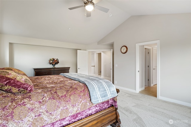 bedroom with light colored carpet, vaulted ceiling, and ceiling fan