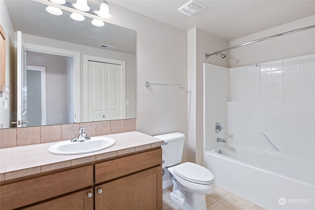 full bathroom with tile patterned floors, vanity, toilet, and tub / shower combination