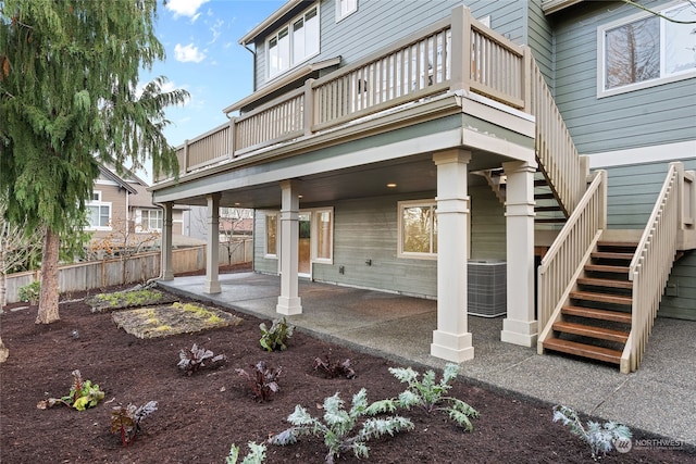 view of patio featuring a balcony and central air condition unit