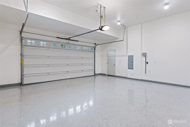 garage featuring electric panel and a garage door opener