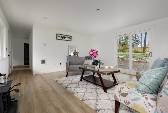 living room with light hardwood / wood-style floors