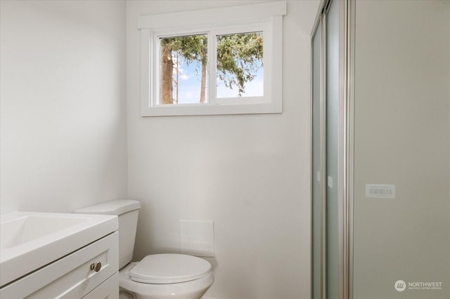 bathroom with vanity and toilet