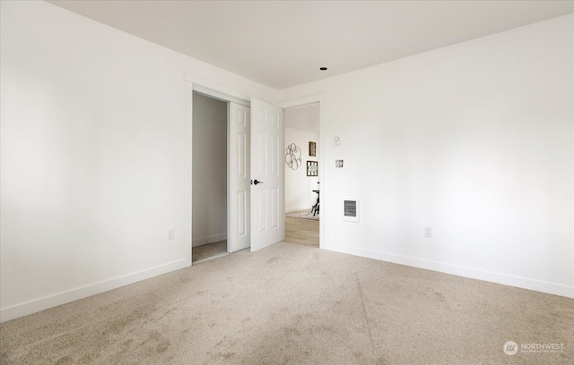 unfurnished room with carpet flooring